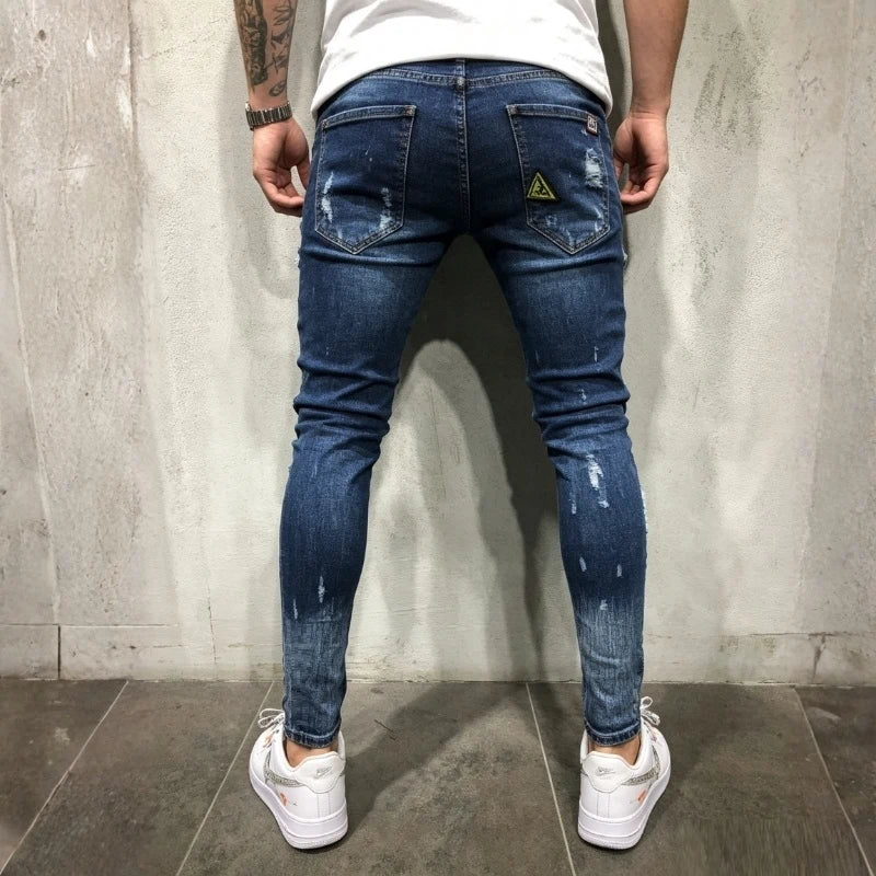 men's ripped patch embroidered skinny jeans in navy, back view