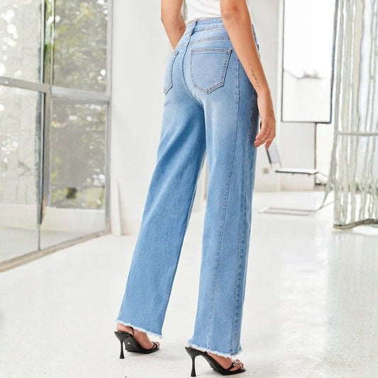 Women's wide leg jeans high waisted baggy raw hem denim in blue, back view