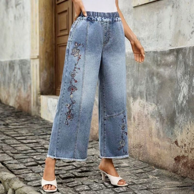 Women's floral embroidered pull on denim wide leg baggy jeans, side view