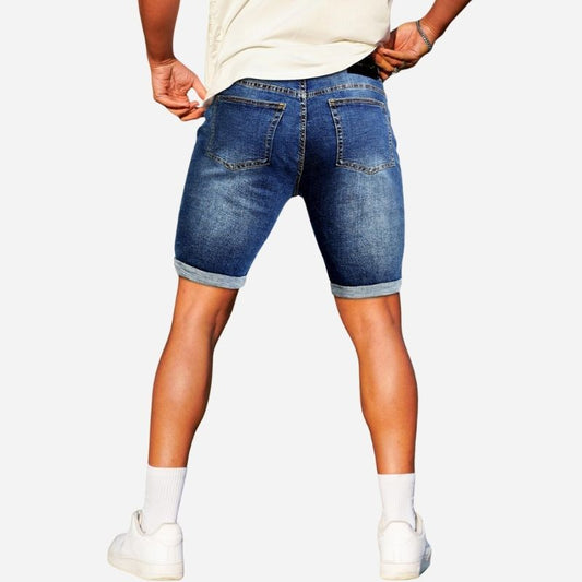Denim shorts men stretch cuffed skinny jean short pants for men in navy, back view