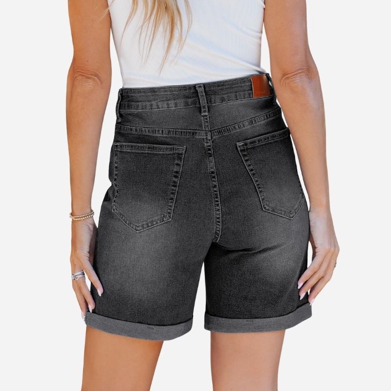 Women high waisted summer fold hem denim shorts in black, back view