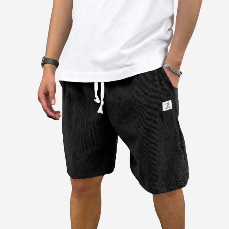 men's elastic waist drawstring summer beach shorts in black, front view