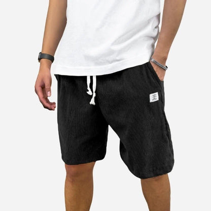 men's elastic waist drawstring summer beach shorts in black, front view