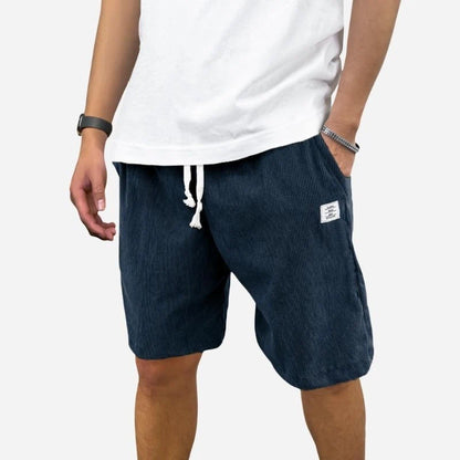 men's elastic waist drawstring summer beach shorts in navy, front view