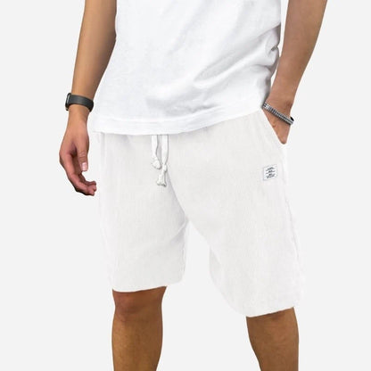 men's elastic waist drawstring summer beach shorts in white, front view