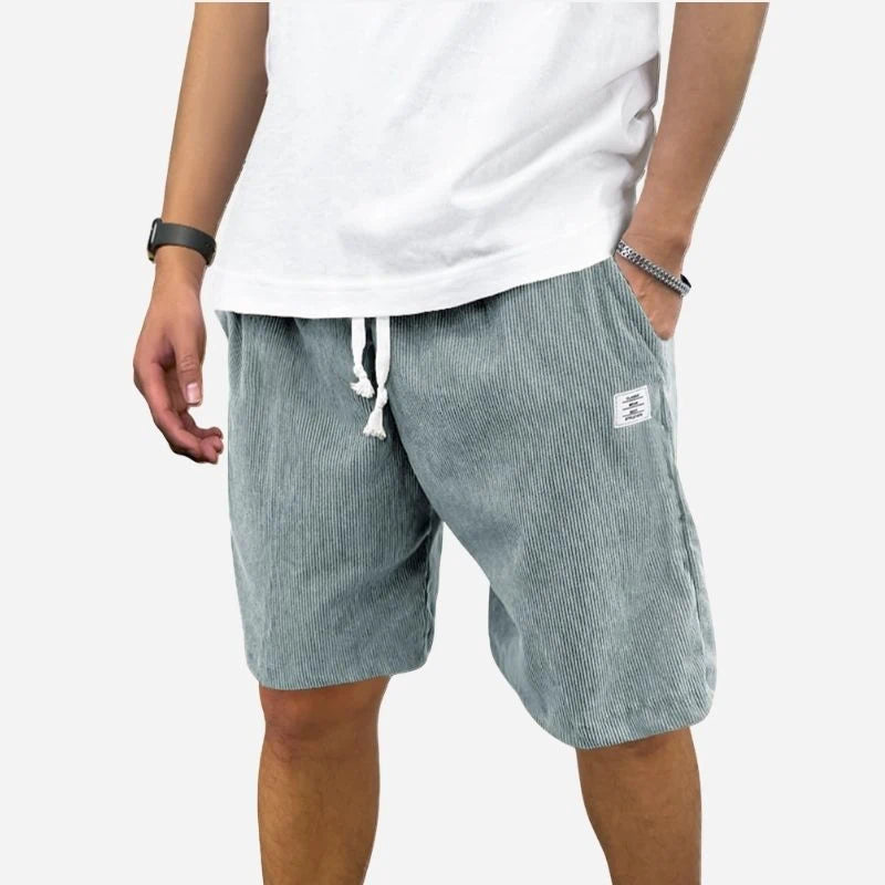 men's elastic waist drawstring summer beach shorts in blue, front view