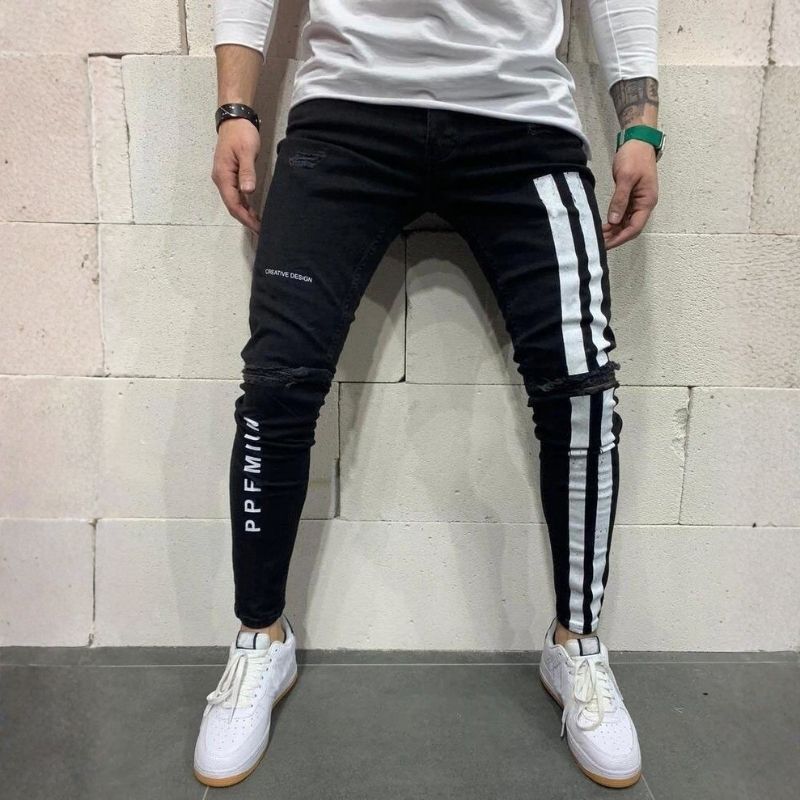 Men's distressed skinny jeans with side stripes stretch street denim in black, front view