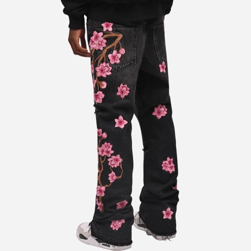 Men's graphic floral embroidered distressed straight leg denim jeans in black, back view