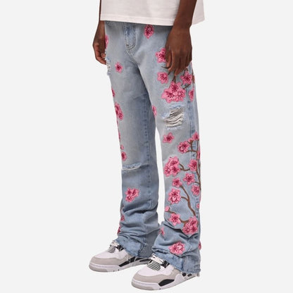 Men's graphic floral embroidered distressed straight leg denim jeans in light blue, side view