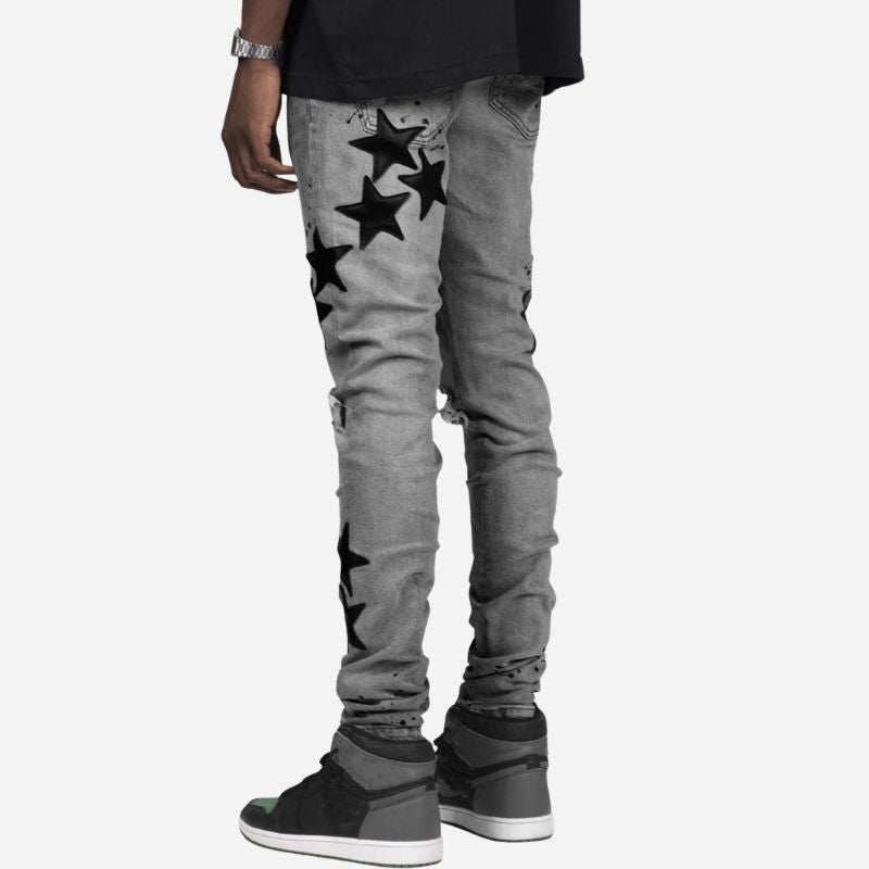 Men's star patch distressed skinny jeans in grey, back view