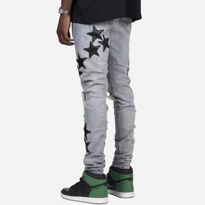 Men's star patch distressed skinny jeans in grey, back view
