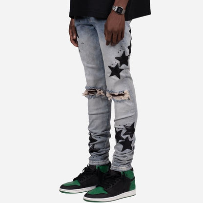 Men's star patch distressed skinny jeans in grey, side view