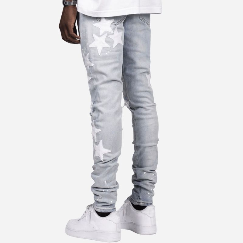 Men's star patch distressed skinny jeans in light blue, back view
