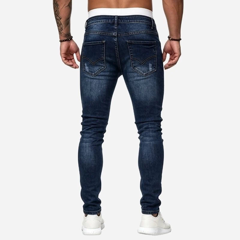 Men's ripped jeans stretch slim fit skinny denim pants in navy, back view