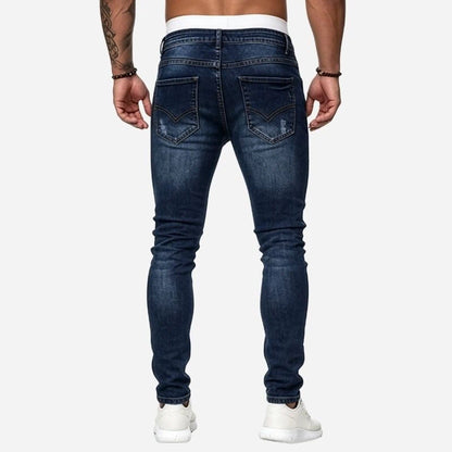 Men's ripped jeans stretch slim fit skinny denim pants in navy, back view