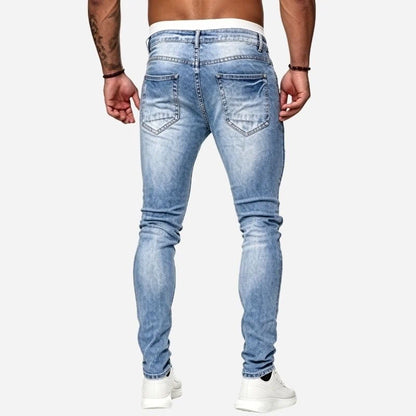 Men's ripped jeans stretch slim fit skinny denim pants in light blue, back view