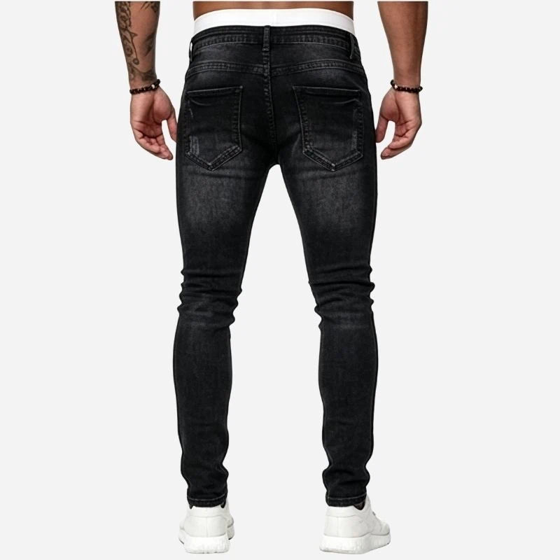 Men's ripped jeans stretch slim fit skinny denim pants in black, back view