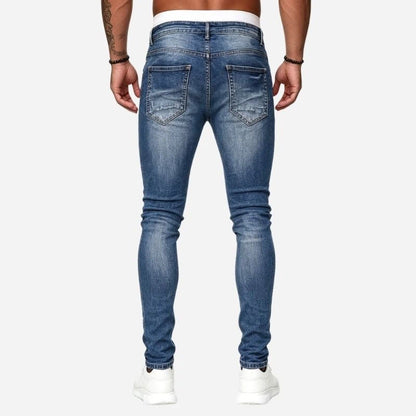 Men's ripped jeans stretch slim fit skinny denim pants in blue, back view