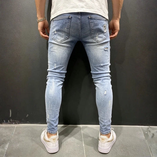 men's ripped patch embroidered skinny jeans in light blue, back view
