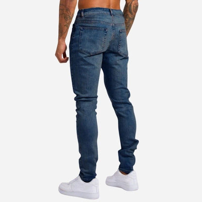 Men's skinny jeans high waisted slim fit denim pants in navy, back view