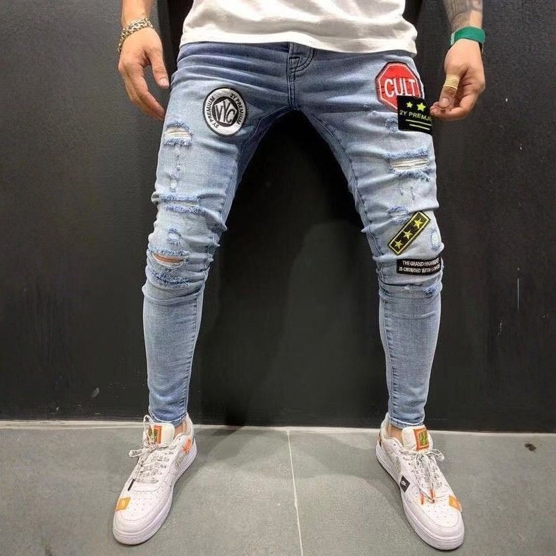 Men's ripped patch embroidered slim stretch skinny jeans in light blue, front view