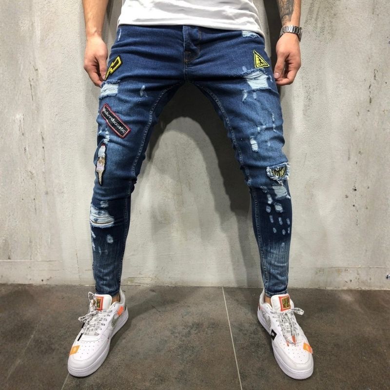 Men's ripped patch embroidered slim stretch skinny jeans in navy, front view
