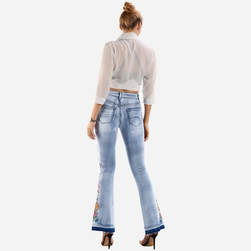 Women's floral embroidered flare jeans, back view
