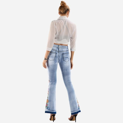 Women's floral embroidered flare jeans, back view