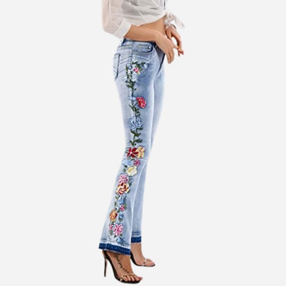 Women's floral embroidered flare jeans, side view