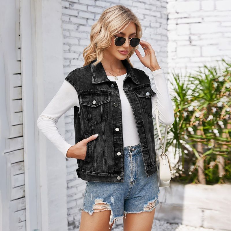 Women's cropped button front denim vest with pockets in black, front view