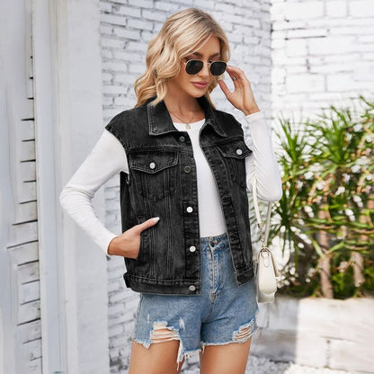 Women's cropped button front denim vest with pockets in black, front view
