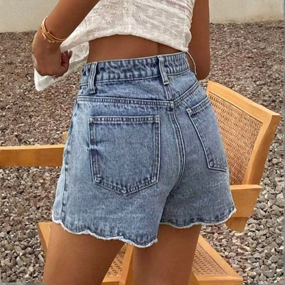 Women's high waist denim shorts with ruffle scalloped hem loose fit, back view