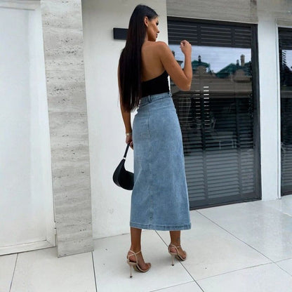 Women’s high waisted button front midi denim skirt with slit in blue, back view