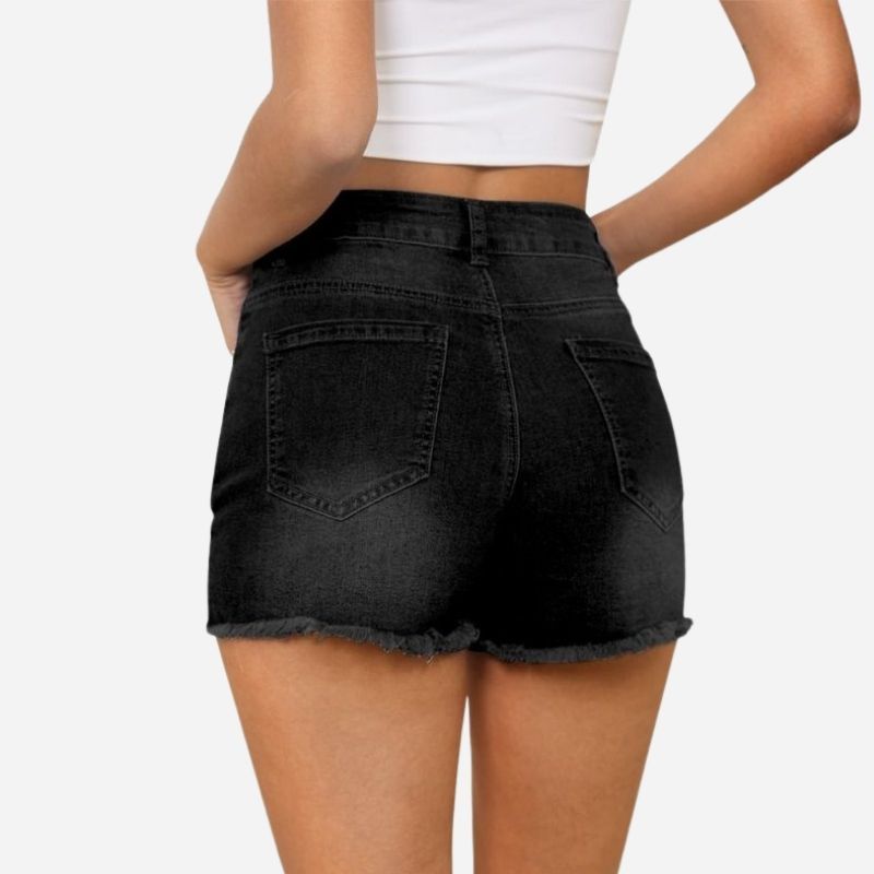 Women's ripped denim jeans shorts in black, back view