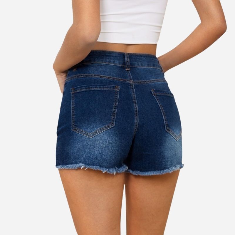 Women's ripped denim jeans shorts in navy, back view
