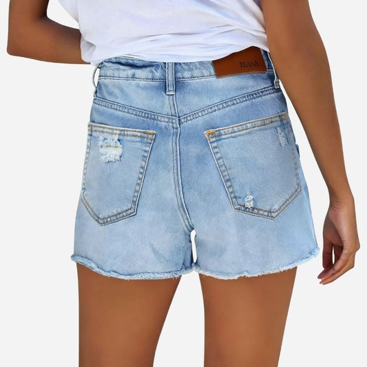Women's ripped denim jeans shorts in blue, back view