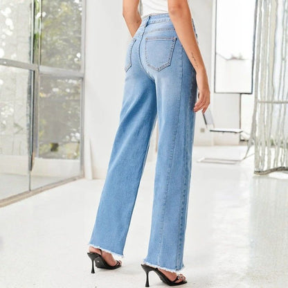 Women's wide leg jeans high waisted baggy raw hem denim in blue, back view