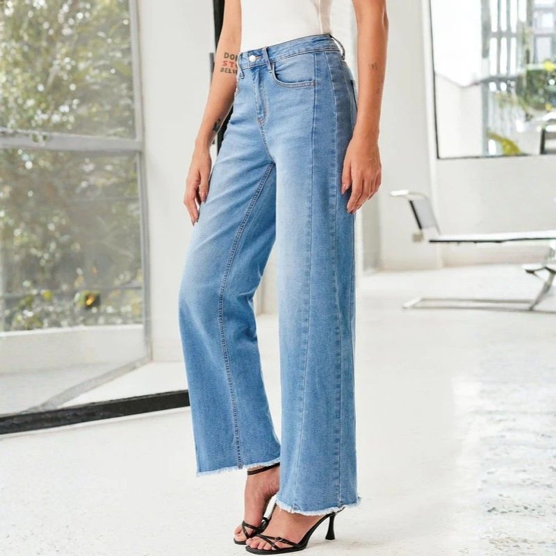Women's wide leg jeans high waisted baggy raw hem denim in blue, side view