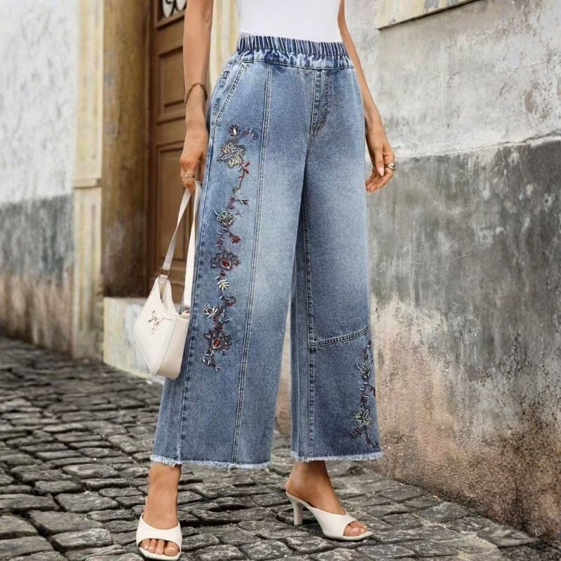 Women's floral embroidered pull on denim straight wide leg baggy jeans, side view